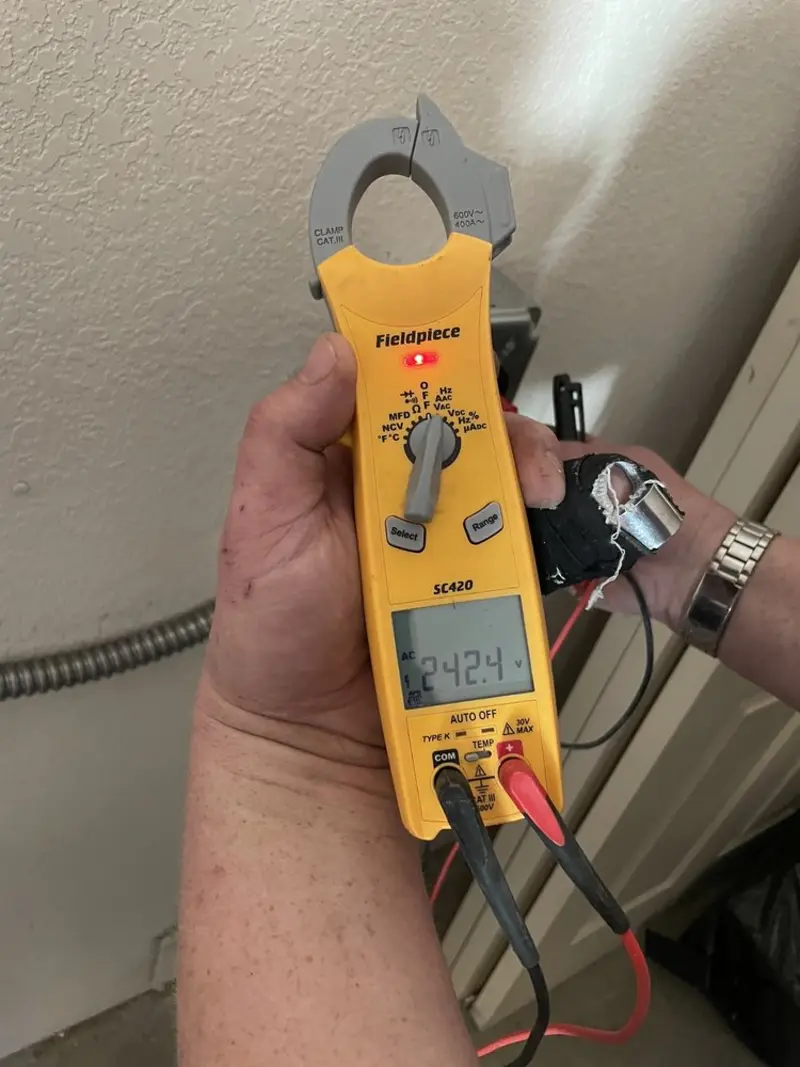 Voltage testing with clamp meter during Ceiling Fan Installation in North Strabane